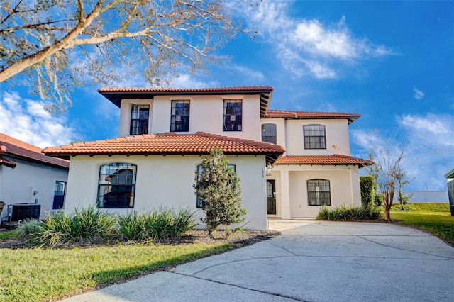 mediterranean / spanish home with central air condition unit