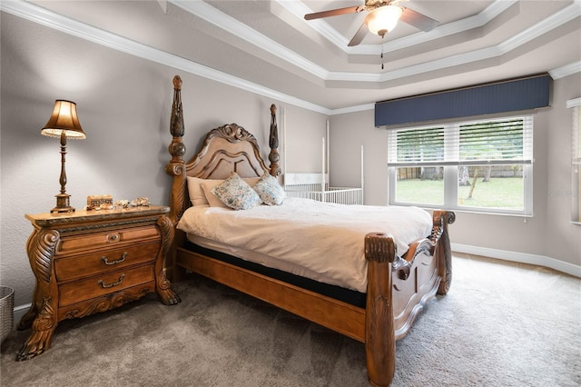 carpeted bedroom with ceiling fan, a raised ceiling, and crown molding