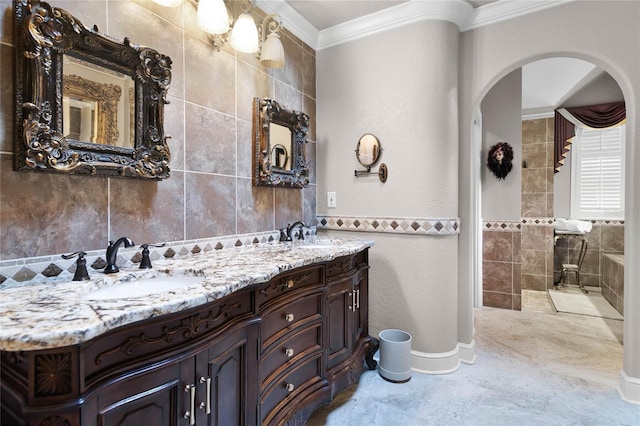 bathroom with vanity, tile walls, and crown molding