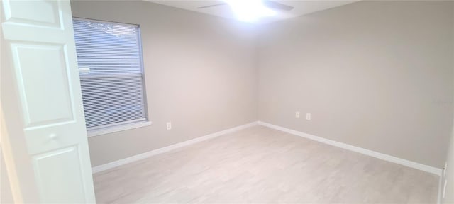 unfurnished room with ceiling fan and light hardwood / wood-style flooring