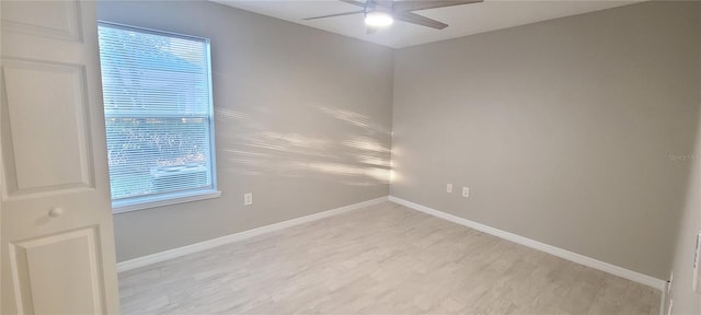 empty room with light hardwood / wood-style flooring and ceiling fan