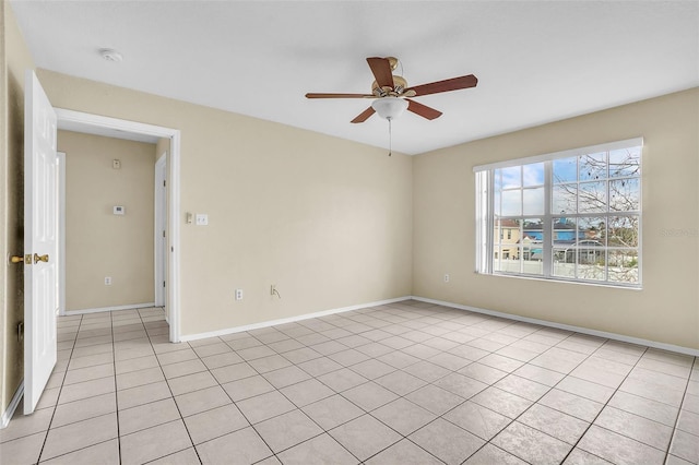 tiled empty room with ceiling fan