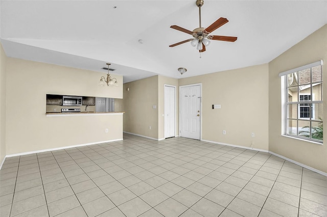 unfurnished living room with light tile patterned floors, lofted ceiling, and ceiling fan with notable chandelier