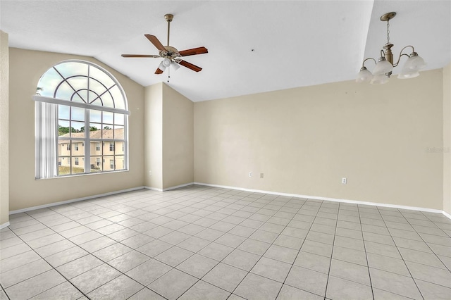 spare room with lofted ceiling, light tile patterned floors, and ceiling fan with notable chandelier