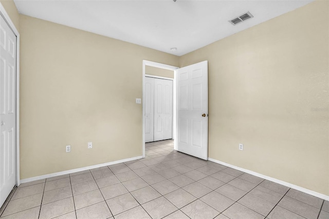 unfurnished bedroom with light tile patterned floors