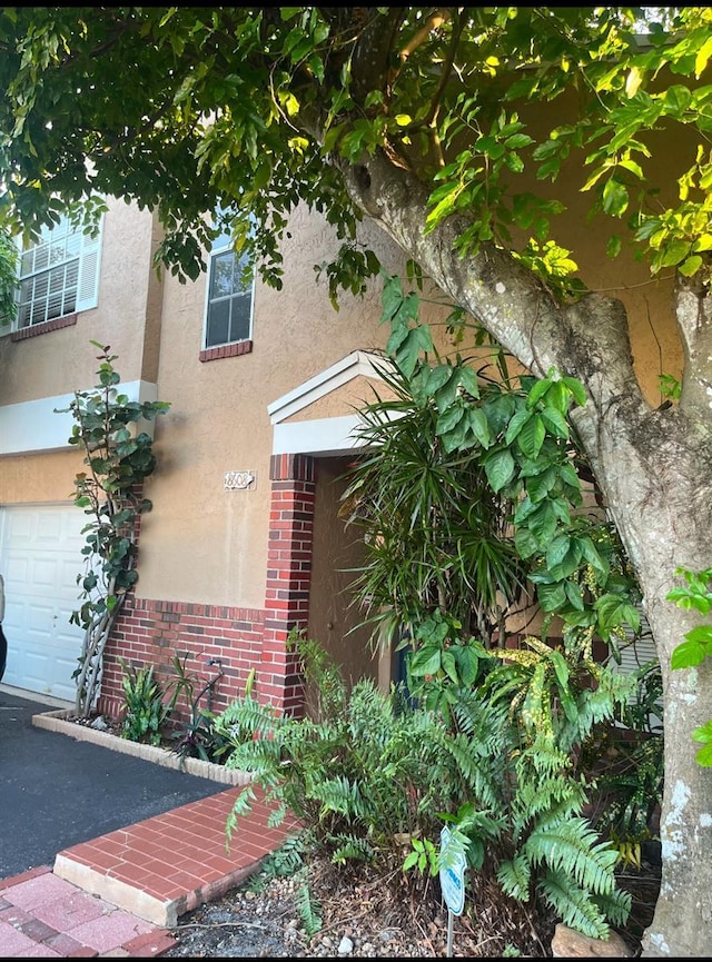 view of side of property featuring a garage