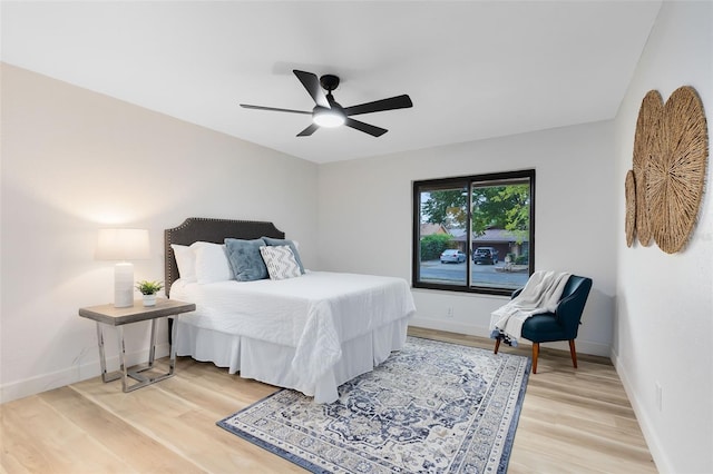 bedroom featuring ceiling fan and light hardwood / wood-style flooring