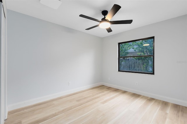 spare room featuring ceiling fan and light wood-type flooring