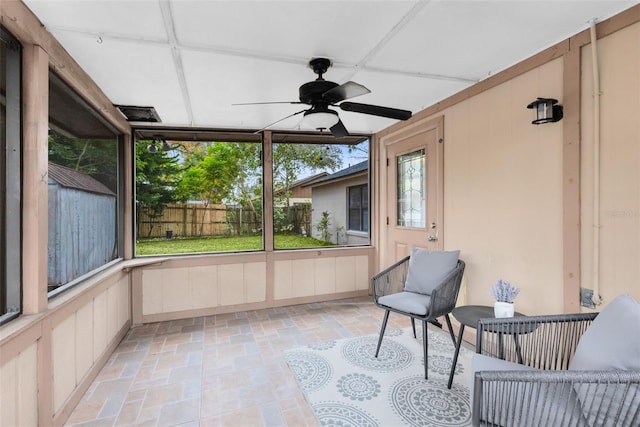 sunroom / solarium with ceiling fan