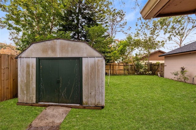 view of outdoor structure with a lawn