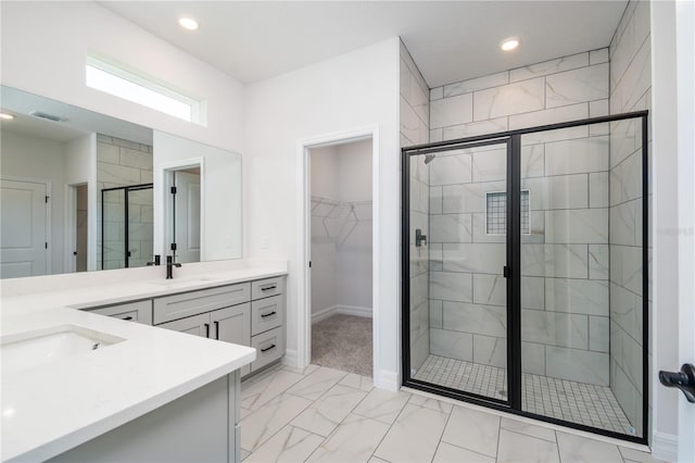 bathroom with recessed lighting, vanity, visible vents, a spacious closet, and a shower stall