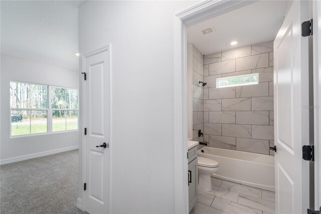 full bathroom with baseboards, visible vents, toilet, bathtub / shower combination, and vanity