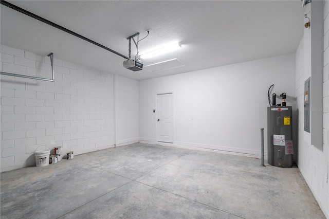 garage with a garage door opener, concrete block wall, electric panel, and water heater