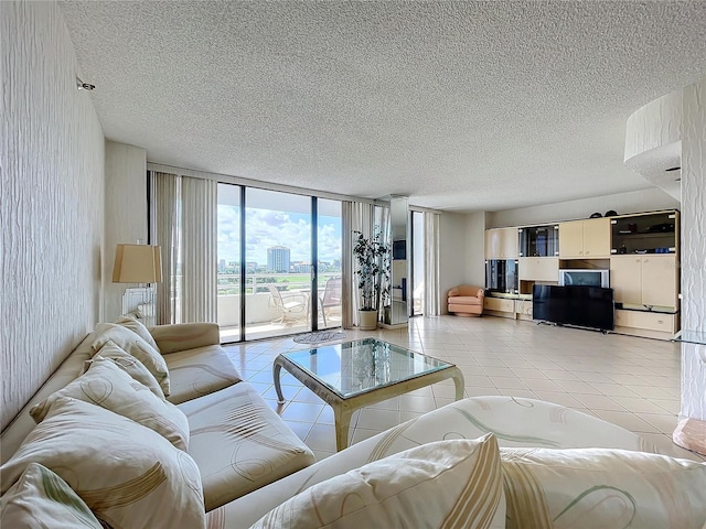 tiled living room with floor to ceiling windows