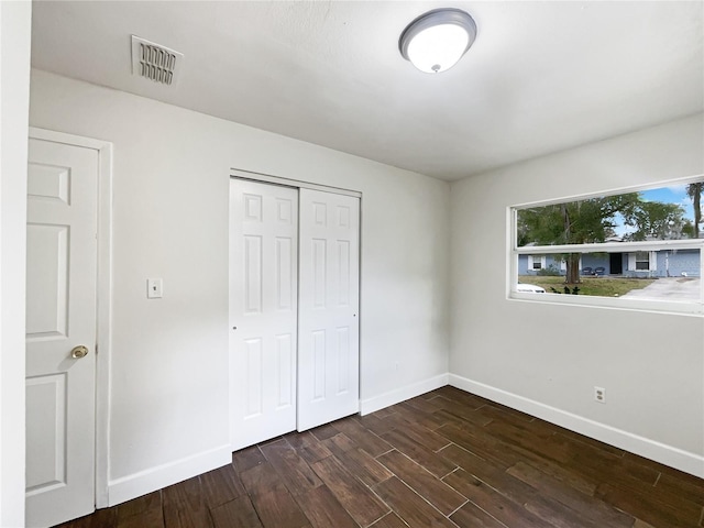 unfurnished bedroom with a closet