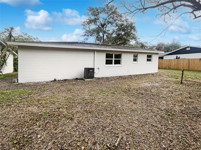 back of house featuring central AC unit