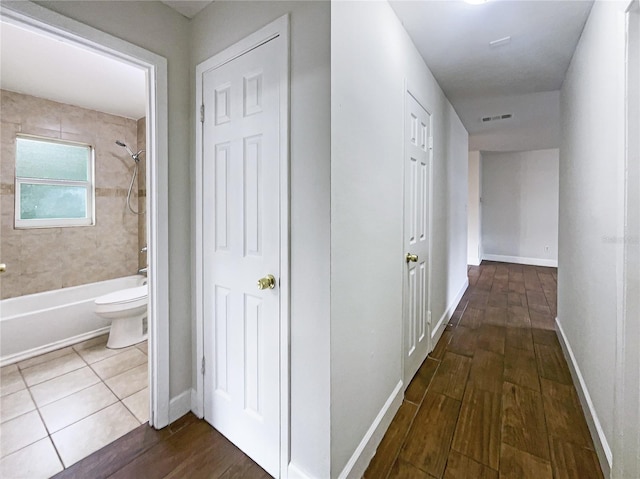 hall with dark hardwood / wood-style floors