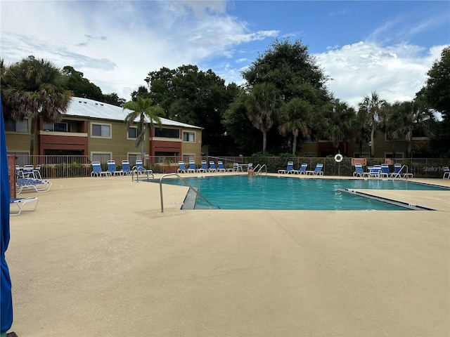 view of swimming pool with a patio area