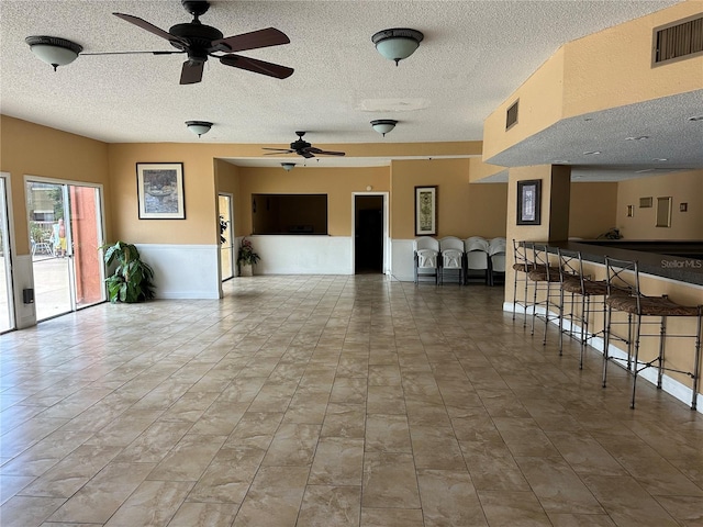 interior space featuring ceiling fan