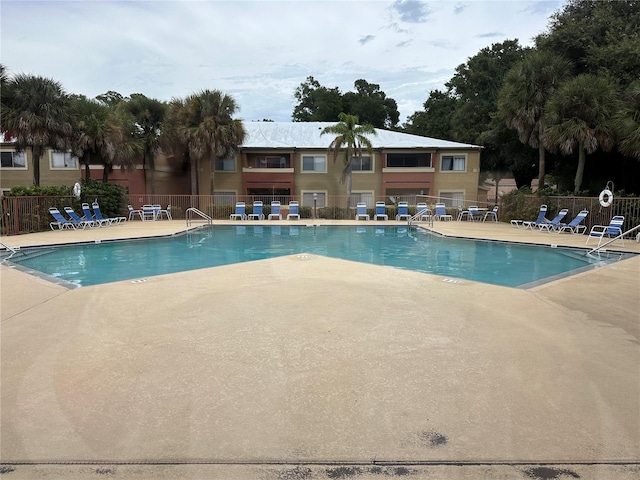 view of swimming pool featuring a patio