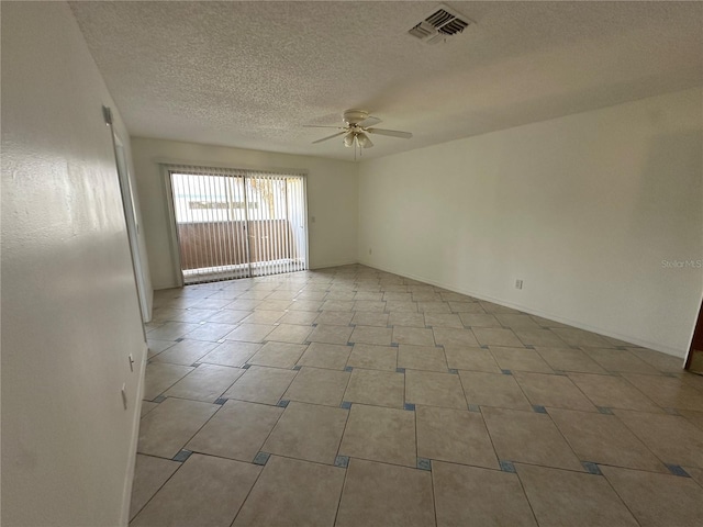 unfurnished room with a textured ceiling and ceiling fan