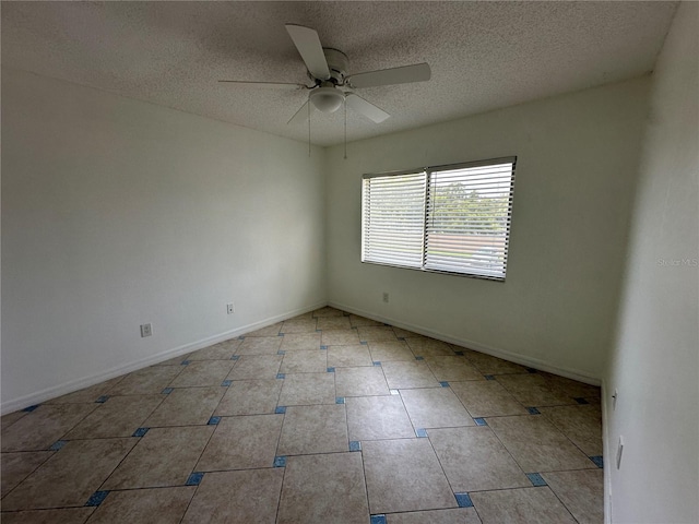 spare room featuring ceiling fan and a textured ceiling