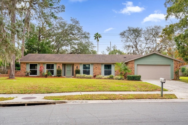 single story home with a garage and a front lawn