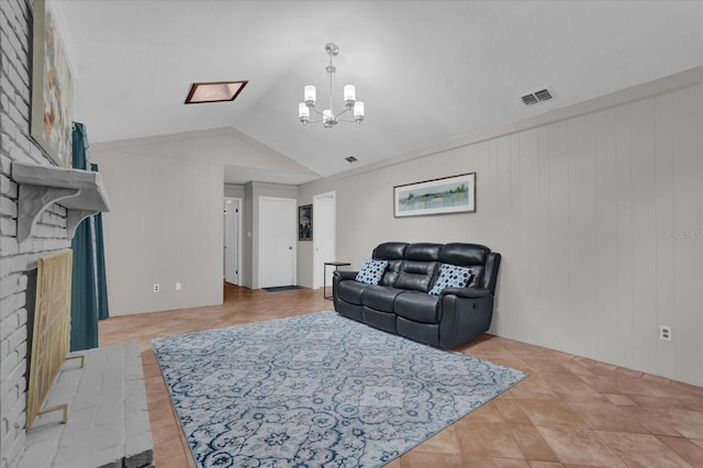 living room with vaulted ceiling, a fireplace, a notable chandelier, and wooden walls