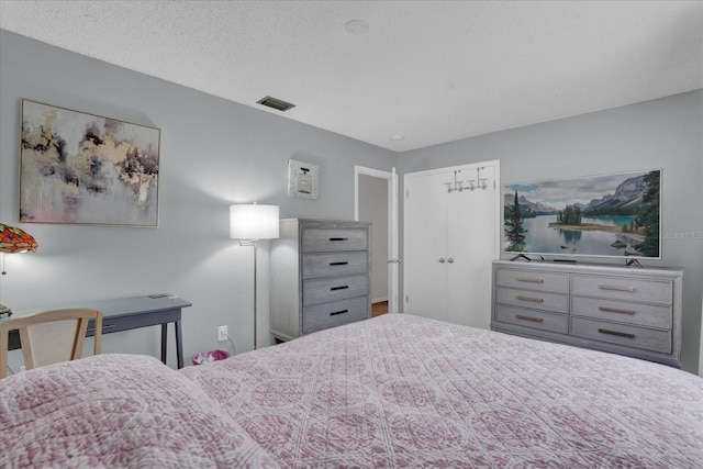 bedroom featuring a textured ceiling