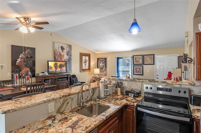 kitchen with ceiling fan, sink, electric stove, pendant lighting, and lofted ceiling