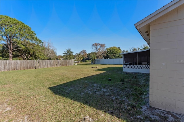 view of yard with a sunroom