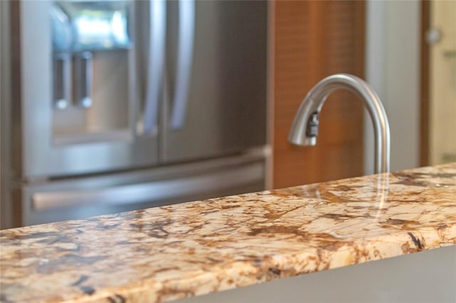 interior details featuring stainless steel fridge