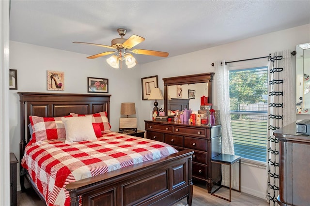 bedroom featuring light hardwood / wood-style floors and ceiling fan