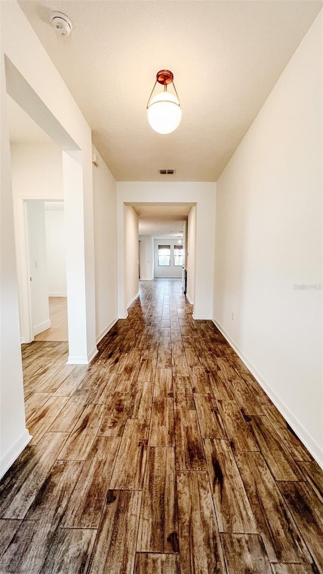 hallway featuring hardwood / wood-style floors