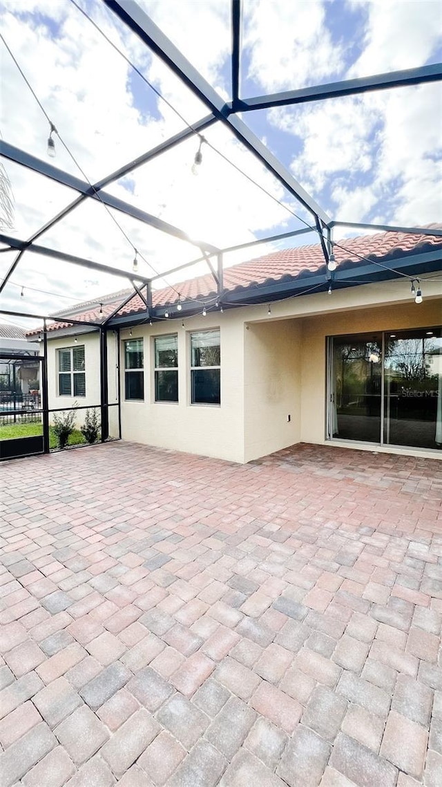 view of patio / terrace with glass enclosure