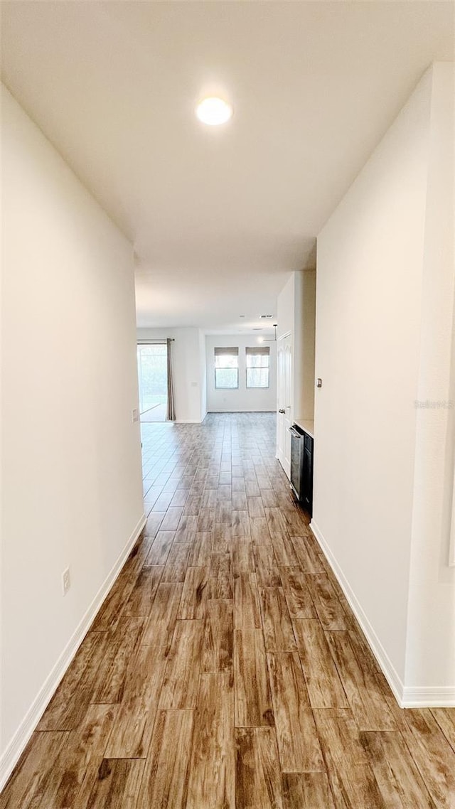 hall with light hardwood / wood-style floors