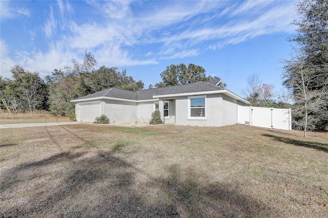 ranch-style house with a front yard and a garage