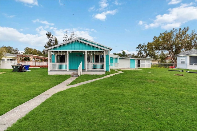 bungalow-style house featuring a front lawn and a porch