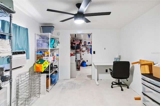 office area featuring ceiling fan and concrete floors