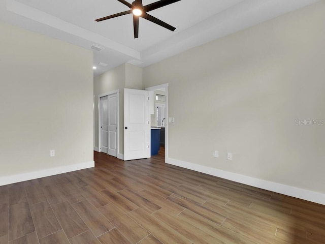 spare room featuring hardwood / wood-style flooring and ceiling fan