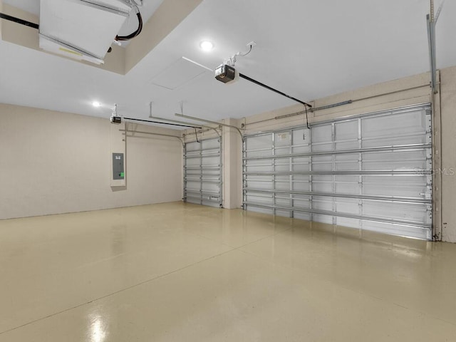 garage with electric panel and a garage door opener