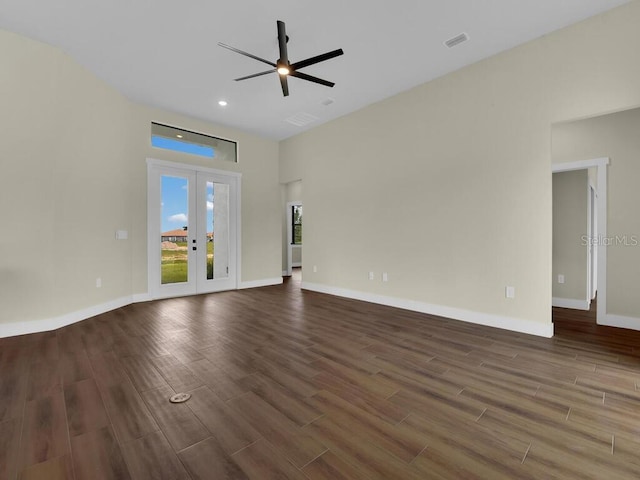 unfurnished living room with ceiling fan, dark hardwood / wood-style floors, and french doors