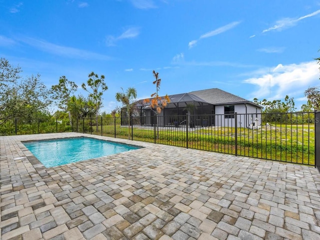 view of pool with a yard, fence private yard, a fenced in pool, a lanai, and a patio area