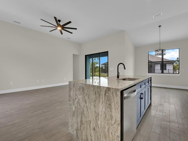 kitchen with dishwasher, light wood-style flooring, plenty of natural light, and a sink