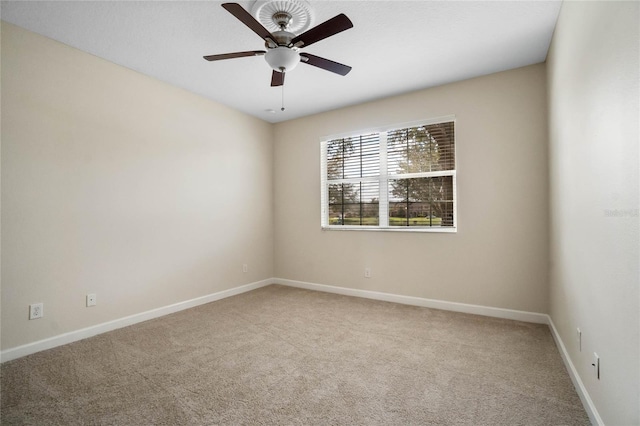 empty room with carpet floors and ceiling fan