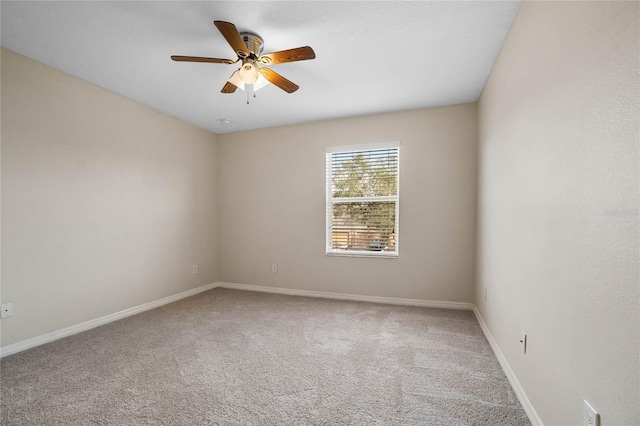 empty room with ceiling fan and carpet floors