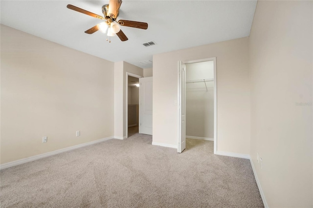 unfurnished bedroom with light colored carpet, a closet, and ceiling fan