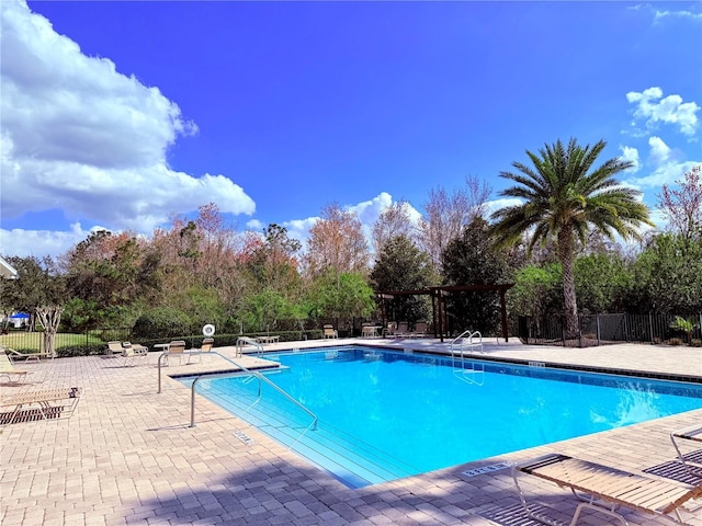 view of swimming pool with a patio