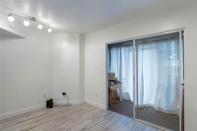 empty room with a textured ceiling