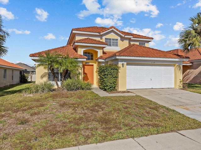 mediterranean / spanish home featuring a front lawn and a garage